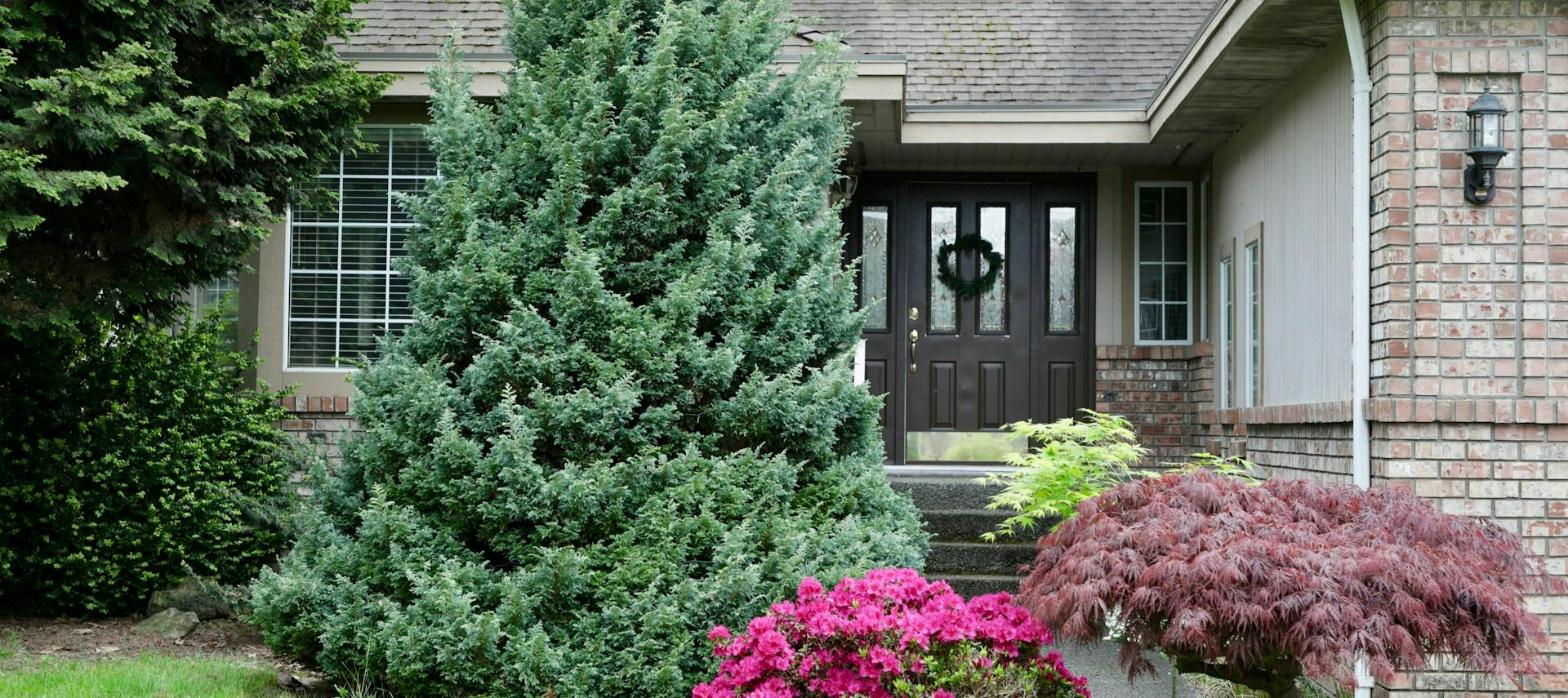 Front entrance and roofline of a brick home